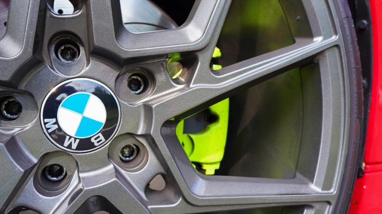 A BMW car wheel, showing the rim, tire, rotor, and brake caliper
