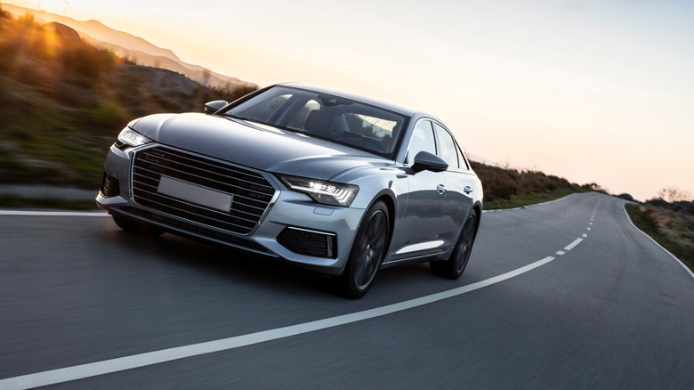 An Audi speeding down a road