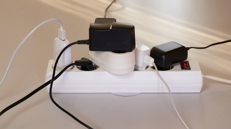 Collection of power cables plugged into a power strip