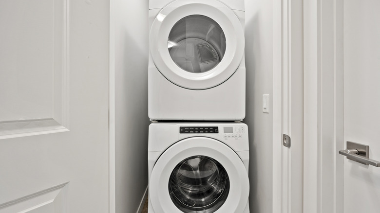 White washing machine and dryer stacked on each other