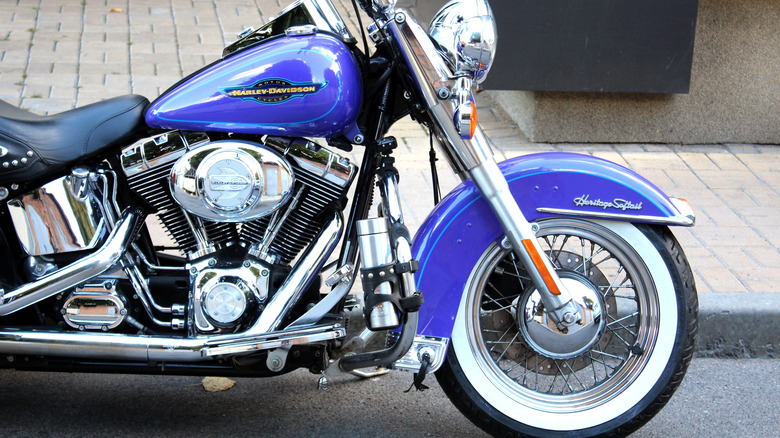 A blue Harley-Davidson Heritage Softail motorcycle with chrome parts