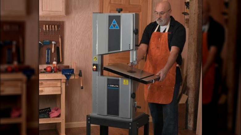 woodworker using Delta bandsaw