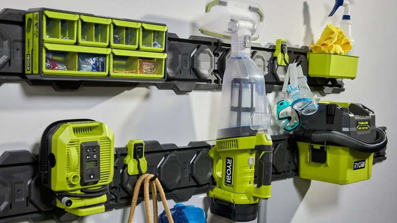Ryobi 18V One+ Pool Vacuum and accessories mounted to wall