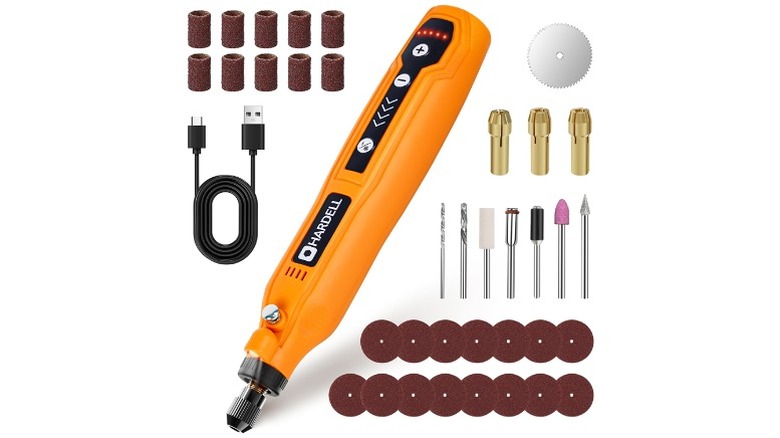 Yellow rotary tool with charging cable, tips, and other accessories