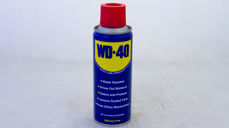A single can of WD-40 on a white surface