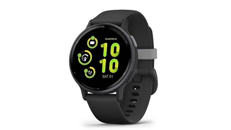 Black smartwatch with a round dial and green time display