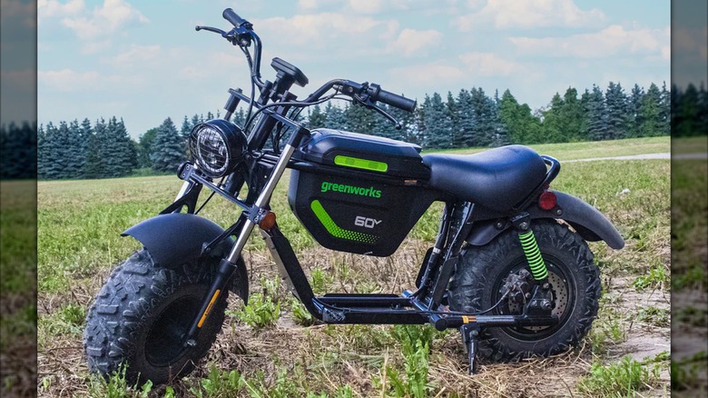 Greenworks 60V Stealth Electric Mini Bike parked on grass