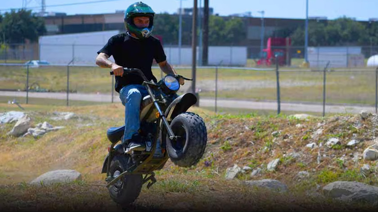 Rider making a jump with the Massimo MB200 196cc Gas-Powered Mini Bike Motorcycle
