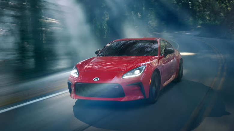 Toyota GR86 driving on forested road