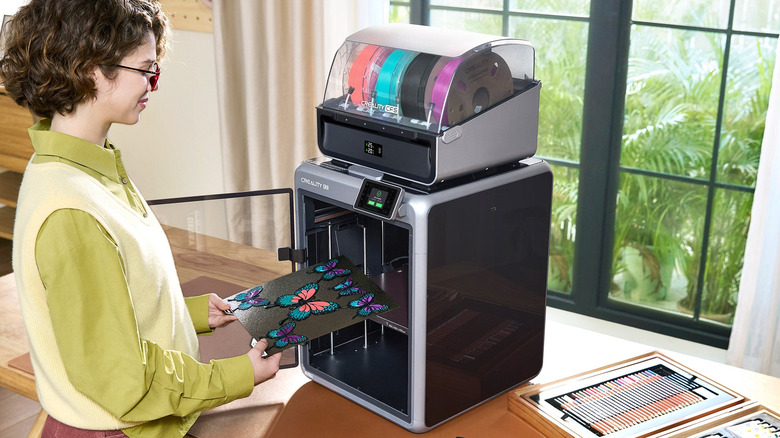 Person prints butterfly models with Creality K2 Pro 3D printer