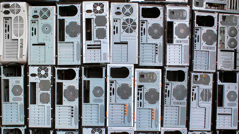 Old PC towers stacked on top of one another