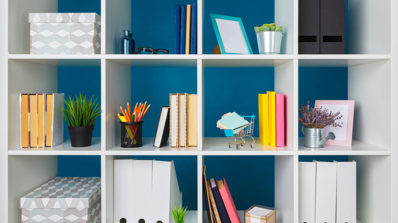 Stocked white cubby shelves