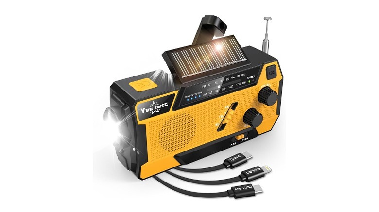 Yellow and black radio with a flashlight and three cables