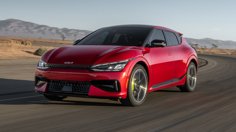 A red 2023 Kia EV6 GT driving