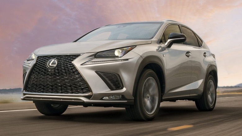 Silver Lexus NX 300 on the road at sunset