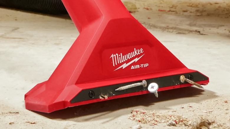 Close up of Milwaukee Air-Tip 2 ½-inch Magnetic Utility Nozzle with nails on it