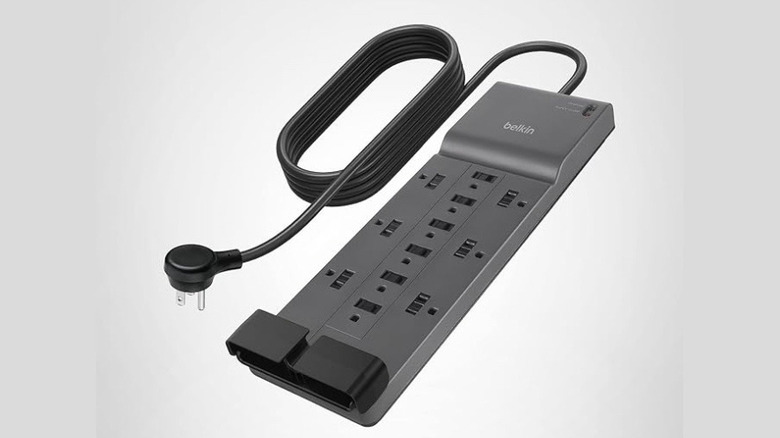 A Belkin power strip with surge protection on a white background