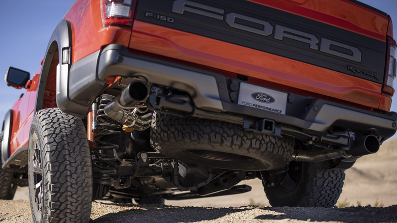 Image of the rear end of a 2021 Ford F-150 Raptor, showcasing exhaust pines