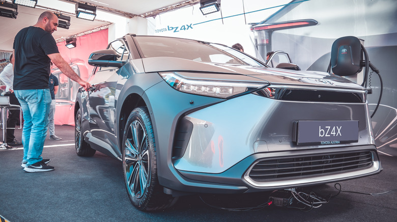 man standing next to a bZ4X