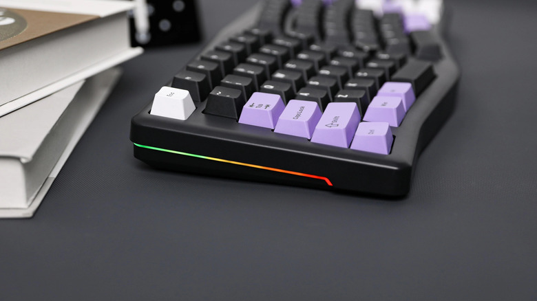 LeoBog A75 keyboard on desk next to books