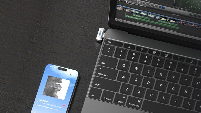 Fiio BT11 dongle connected to MacBook with iPhone close by