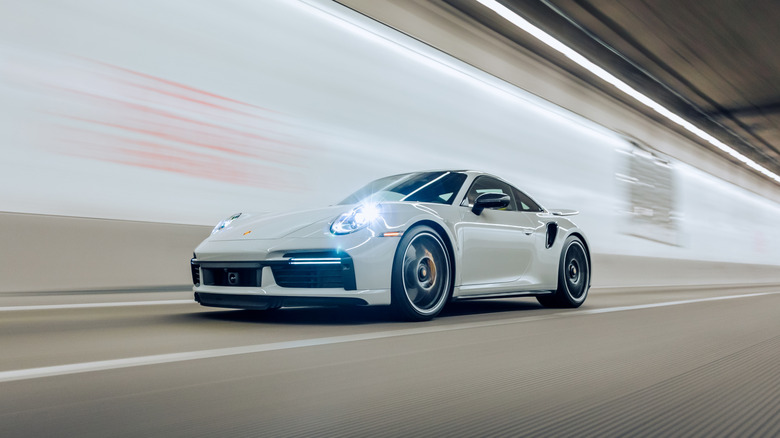 A gray Porsche 911 driving