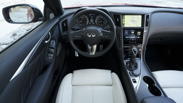 Infiniti Q50 interior dashboard with white leather seats