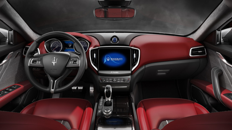 Maserati Ghibli interior dashboard with red leather seats and inserts