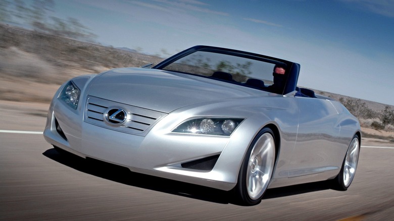 2004 Lexus LF-C Concept driving at speed with the top opened front 3/4 view