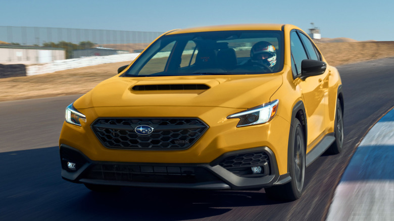 Front 3/4 view of Subaru WRX Series Yellow in track setting