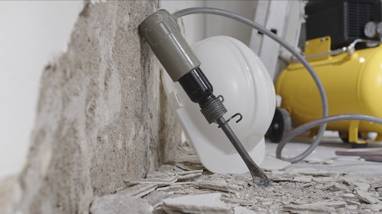 Air hammer to chisel concrete