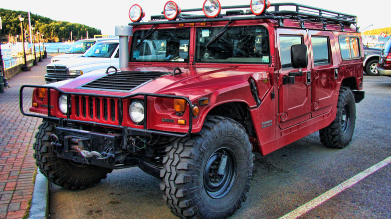 Red Hummer H1 SUV parked