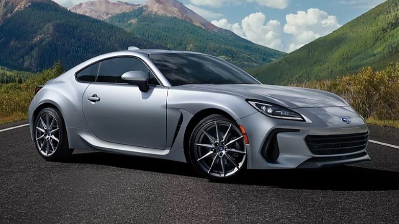2025 Subaru BZR parked on a road with mountains in the background