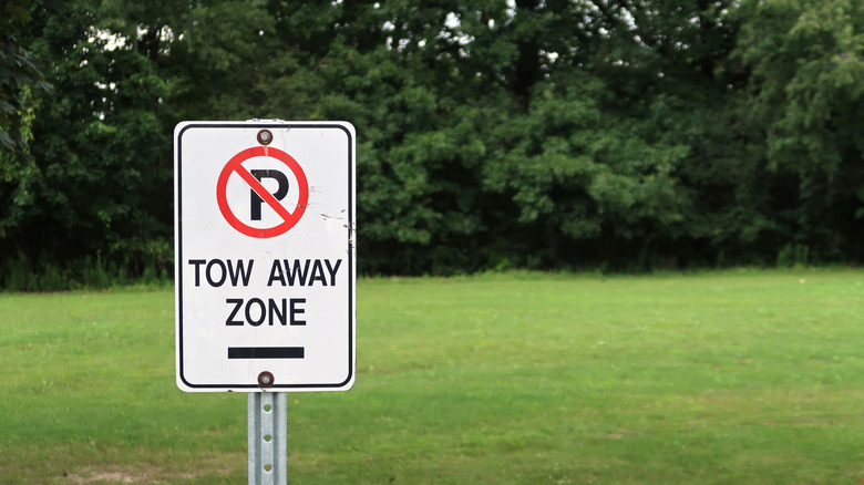 Tow away zone sign