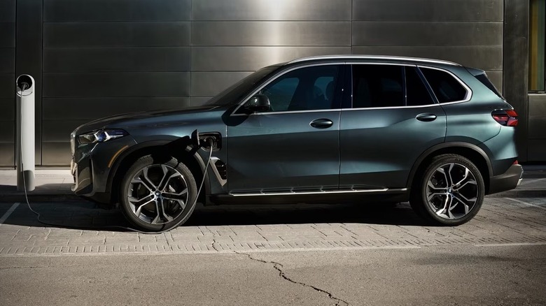 Emerald BMW X5 PHEV at a charging station
