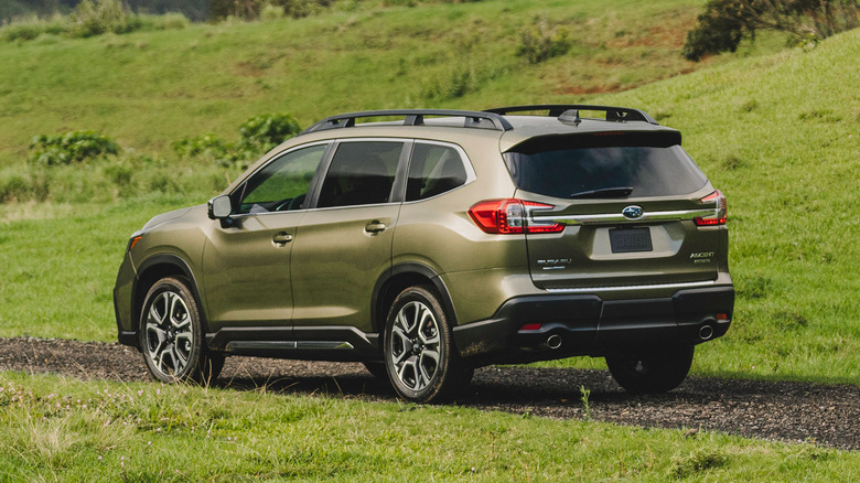 Green Subaru Ascent driving on a paved path in the country