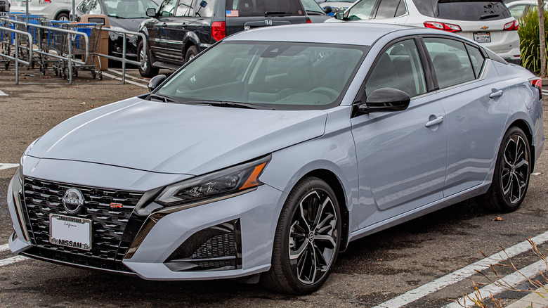 A matte gray Nissan Altima in a parking lot