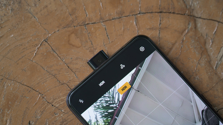 Pop-up selfie camera on a smartphone