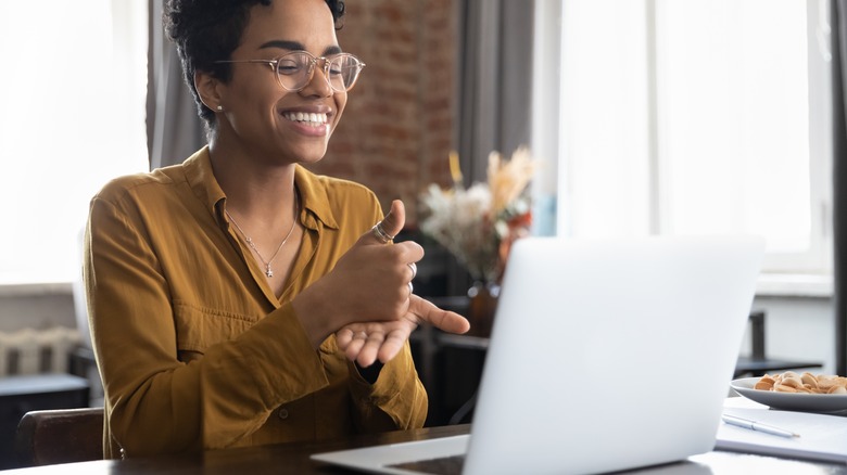 woman making hand gestures