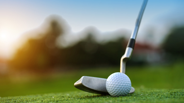 golf putting on green course