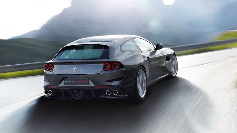 Ferrari GTC4Lusso cornering at speed rear 3/4 view
