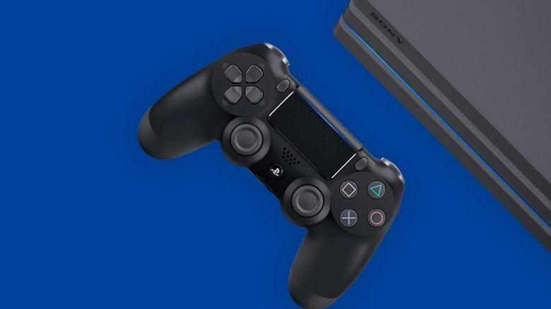 DualShock 4 PS4 controller alongside PS4 Slim