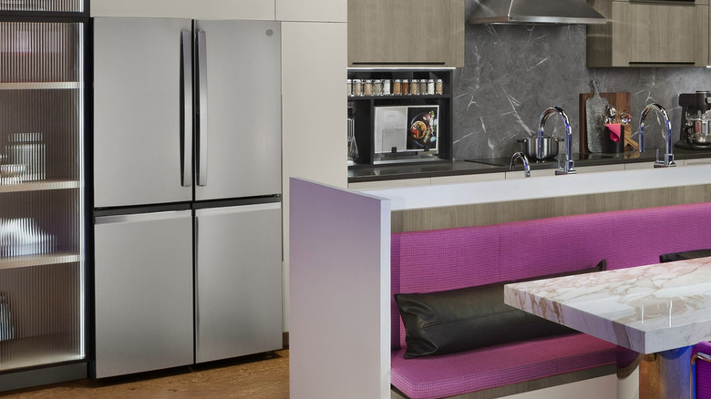 A GE ENERGY STAR 22.9 Cu. Ft. Counter-Depth Quad-Door Refrigerator with Dual-Dispense AutoFill Pitcher and Door in Door