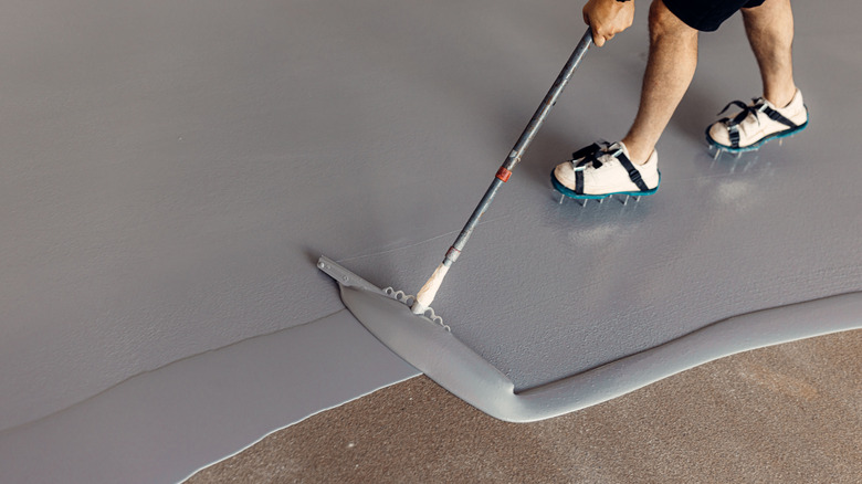 A floor being coated in epoxy material