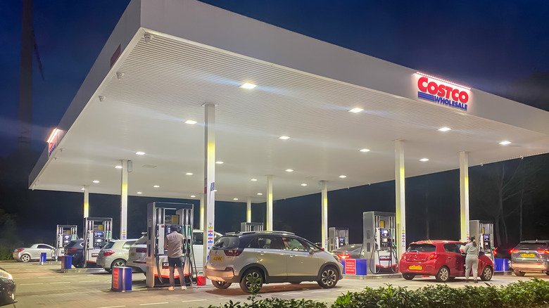 Cars getting gas at Costco at night