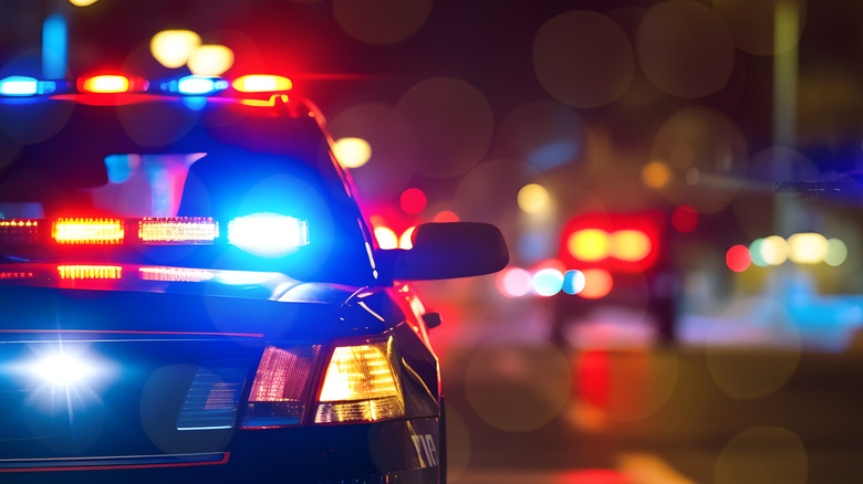 Police car with lights on at night