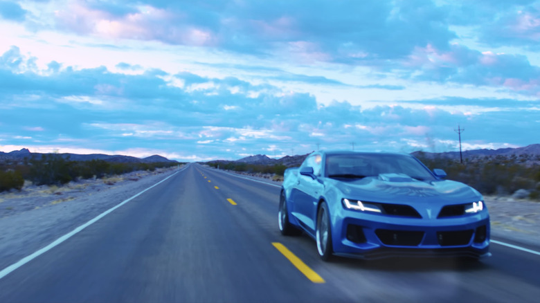 A blue Trans Am Worldwide 455 Super Duty from TAW on empty road