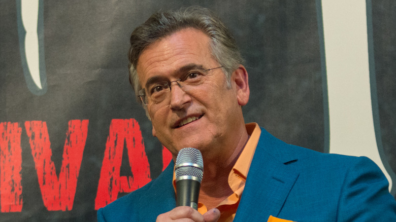 Bruce Campbell speaking in front of a crowd