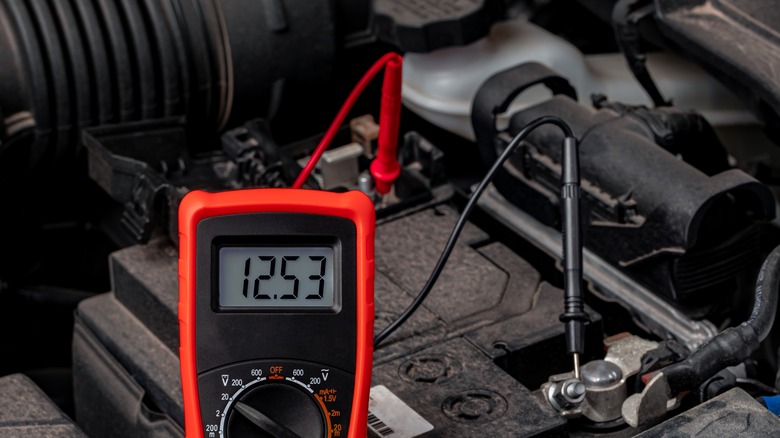 Battery tester checking battery voltage