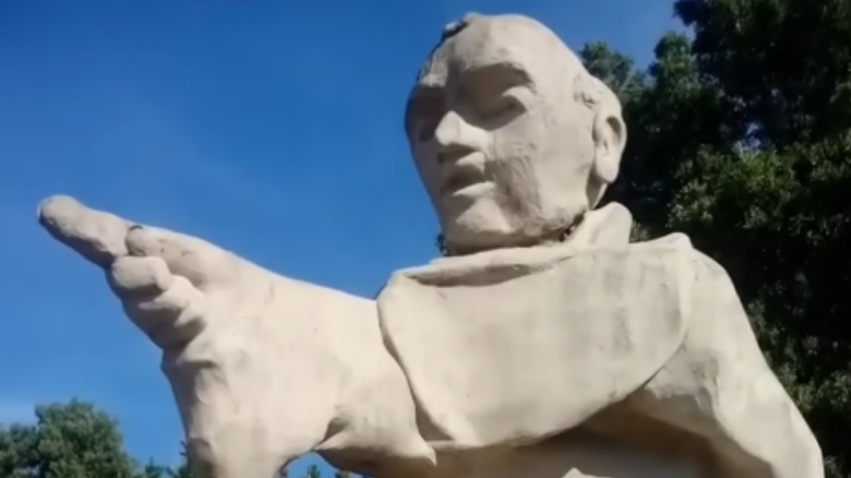 Close up of Junípero Serra statue pointing